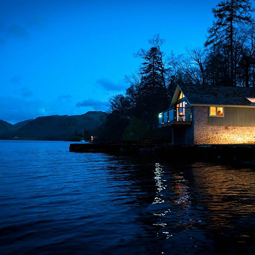 A Sykes Holiday Cottage overlooking a lake in the Lake District National Park