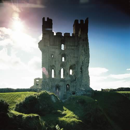 Rays of sun shining through a castle ruin