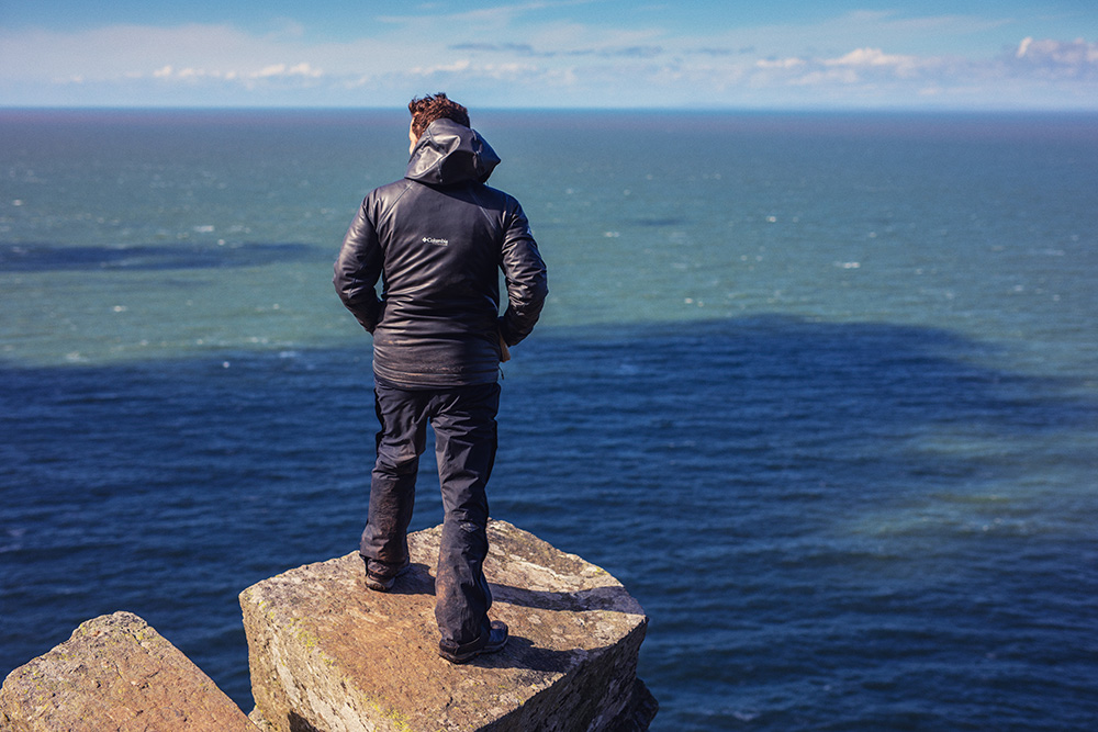 Ranger on a high cliff over the sea